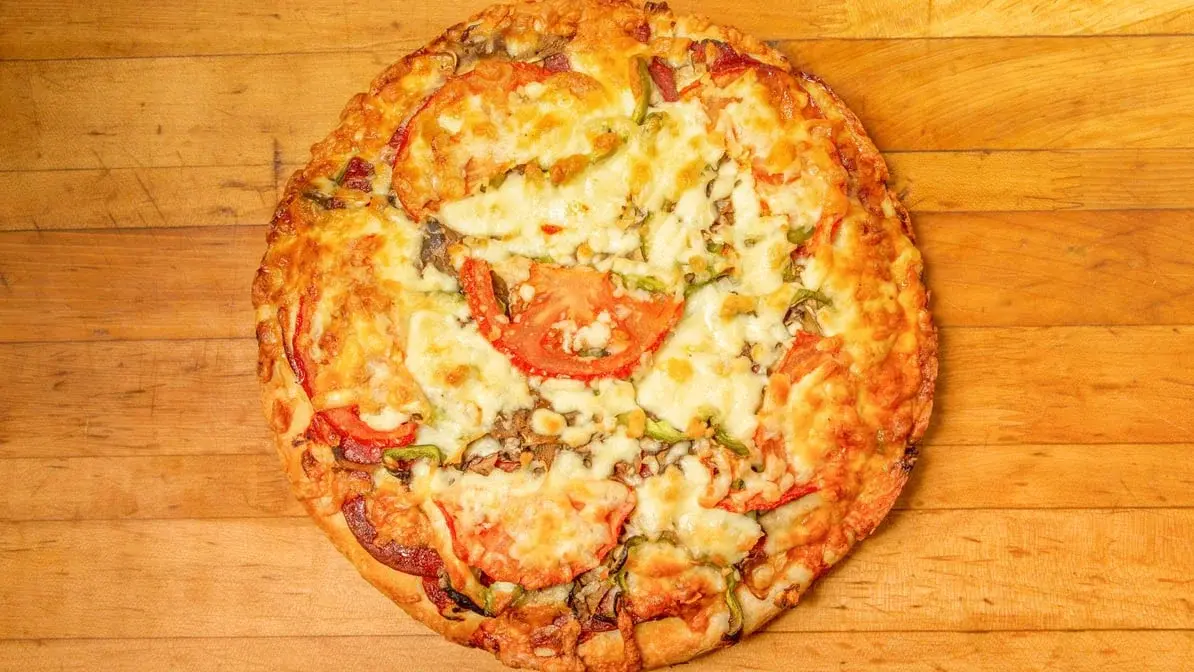 Crispy chicken wings in various flavors at Jon's Pizza Calgary