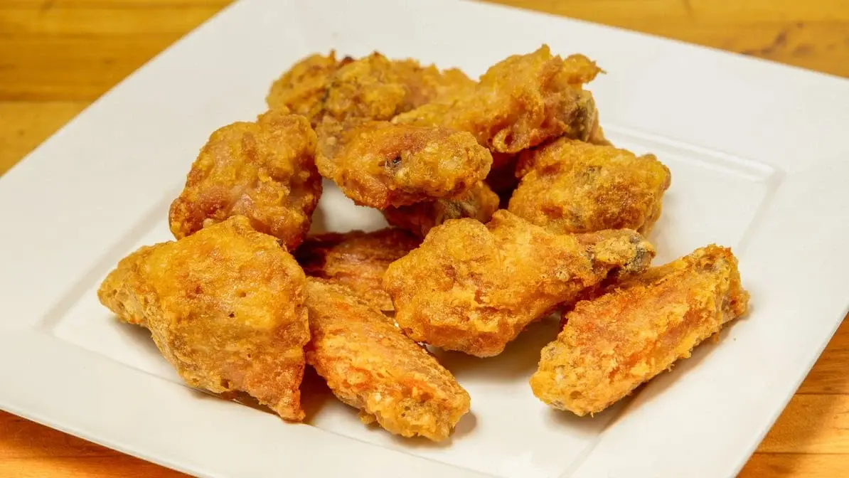 Crispy Wings at Jon's Pizza Calgary - Honey-hot and butter buffalo flavors